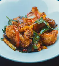 Fisherman'S Basket Sliced Fish, Squid And Shrimp In A Mixture Of Basil, Oriental Sauces And Bell Peppers